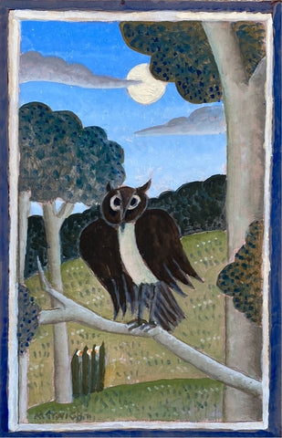 Owl on a tree branch